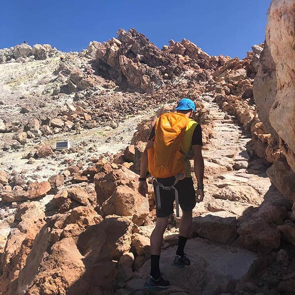 Man hiking the trail to the crater of Mount Teide