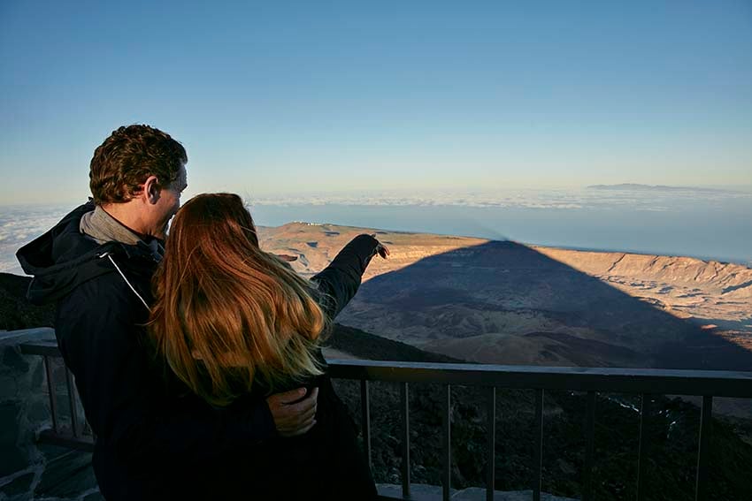 Couple looking at the shadow projected by Mount Teide